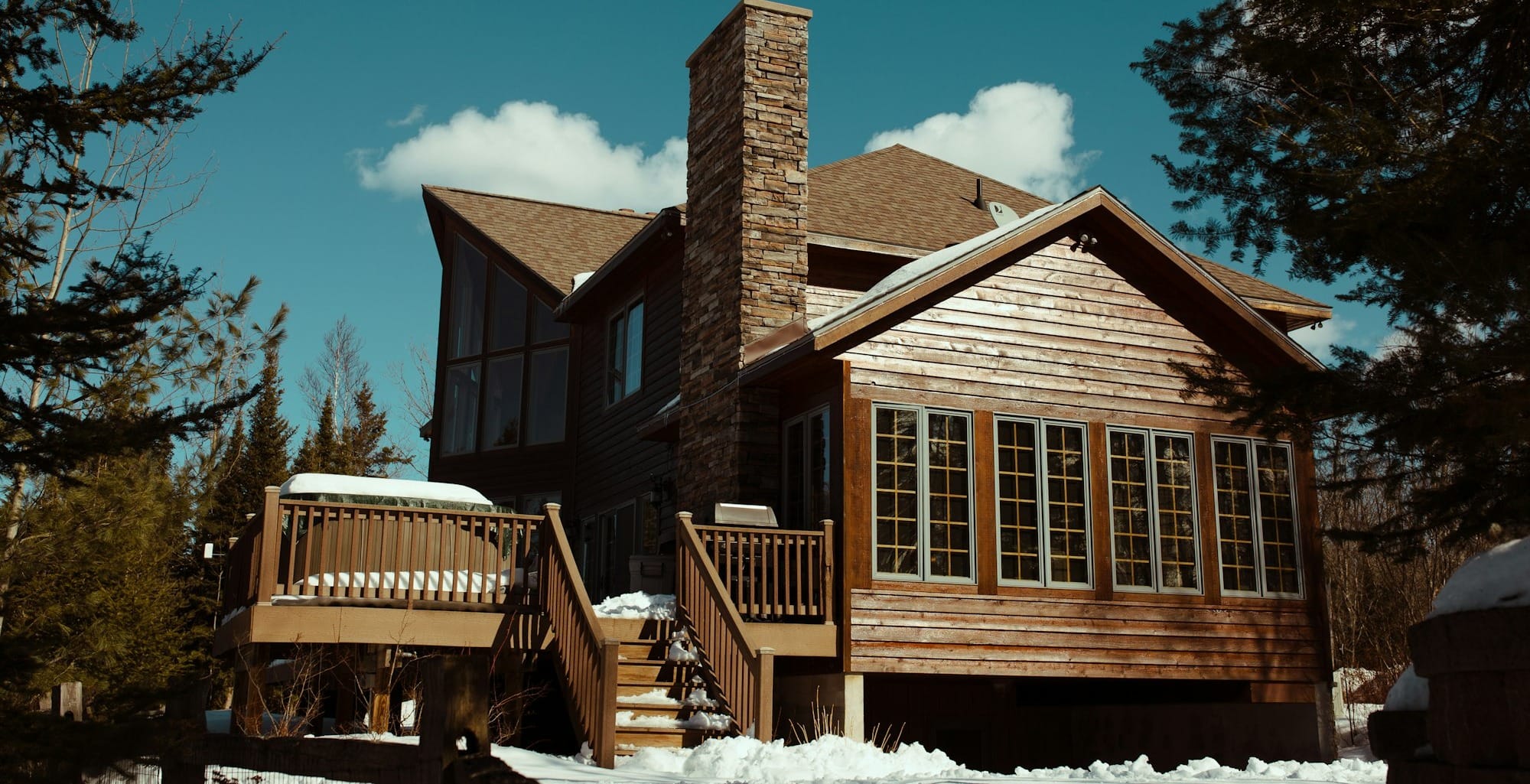 brown house surrounded by trees