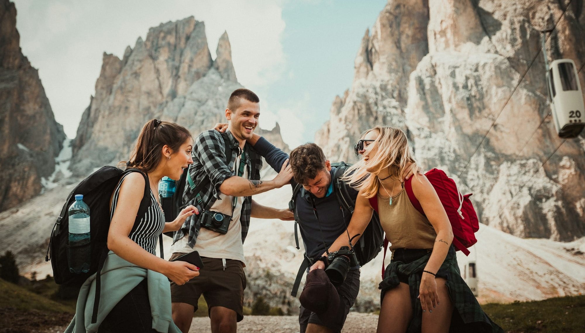 low-angle photography of two men playing beside two women