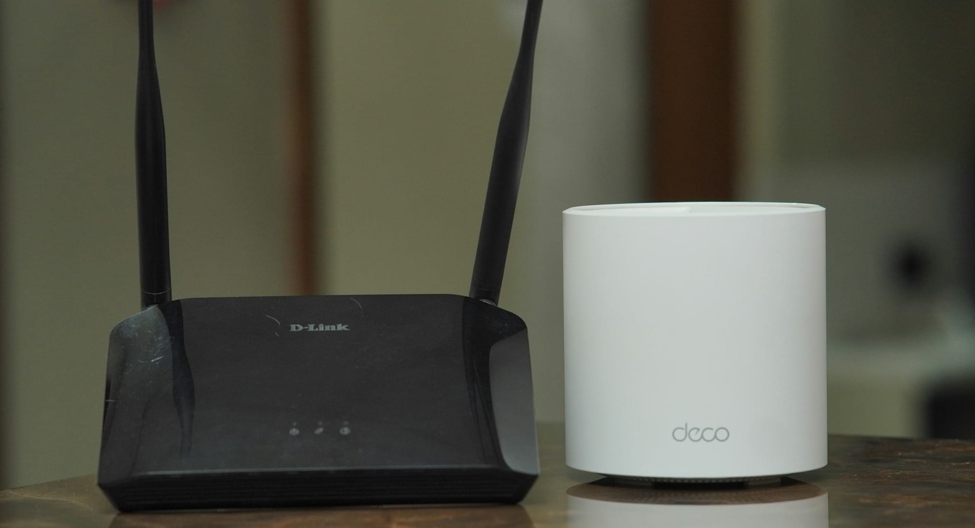 a couple of routers sitting on top of a table